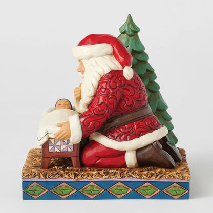 Santa Kneeling over Baby Jesus