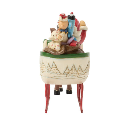 Rudolph Pulling Santa in Sled